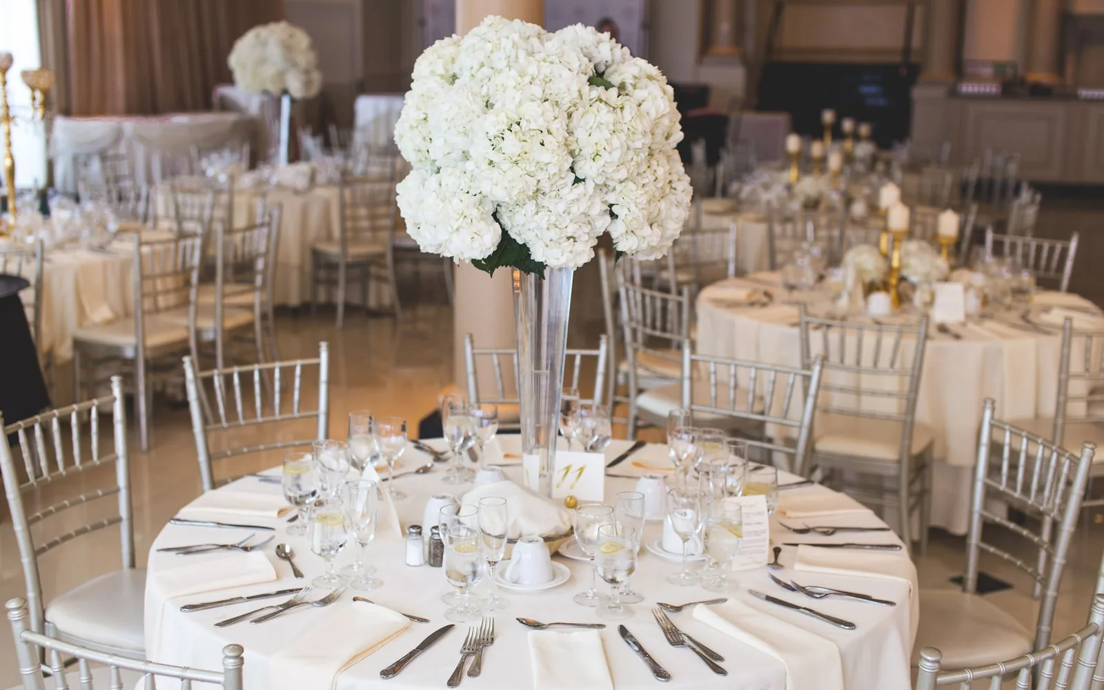 Hospitality venue prepared for a private event with tables and warm lighting